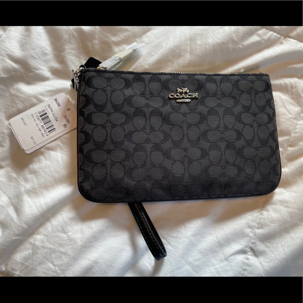 Coach wristlet with tags